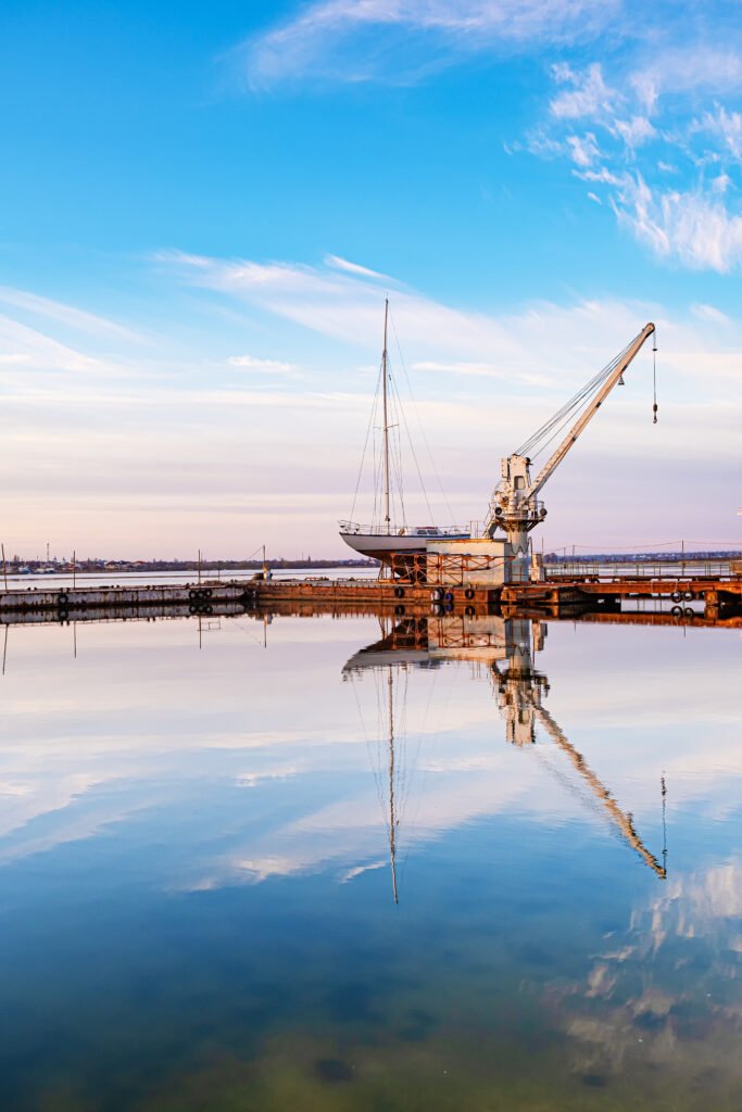 small yacht under repair in an old dock.